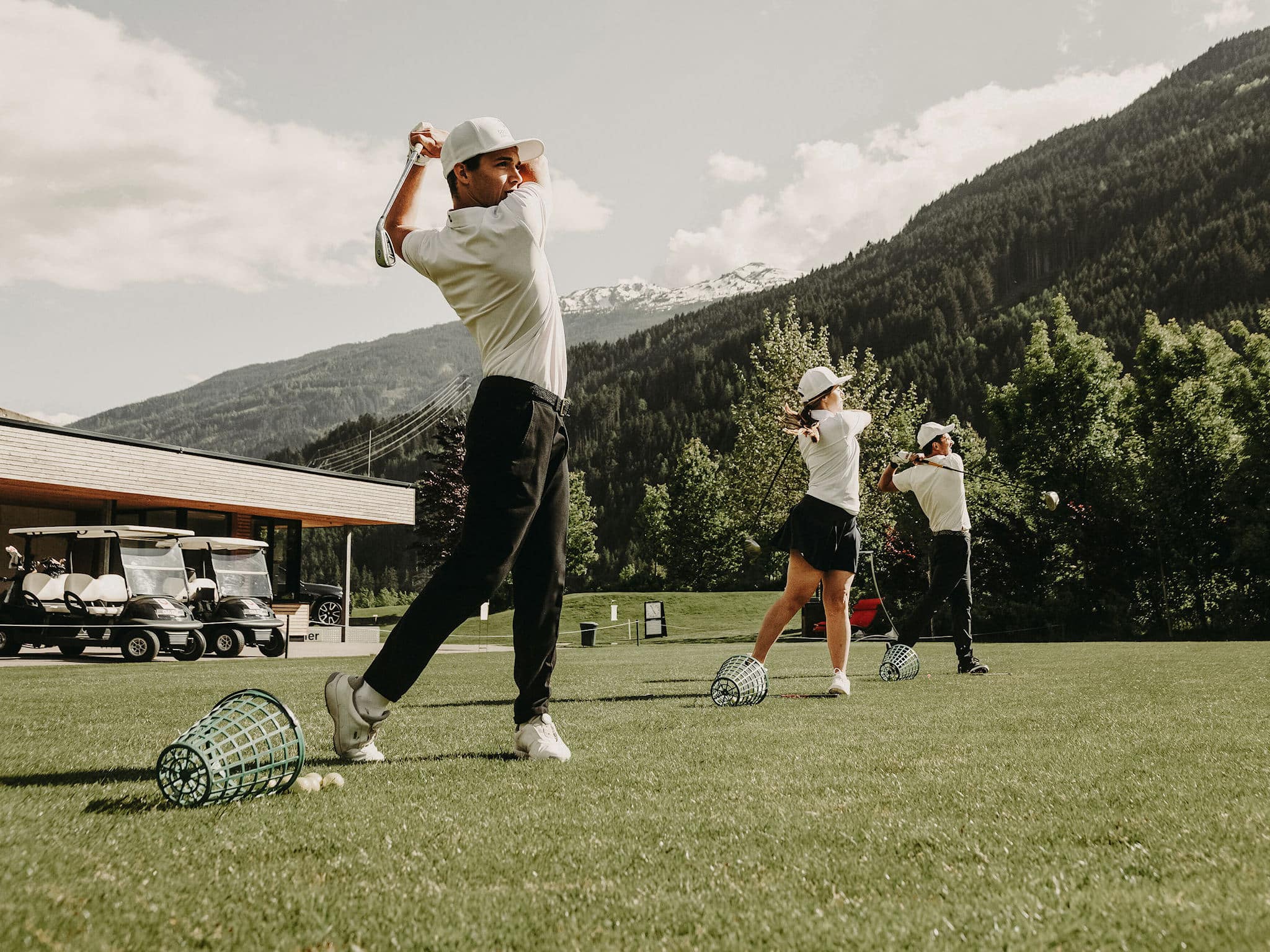 Golfers teeing off on the golf course